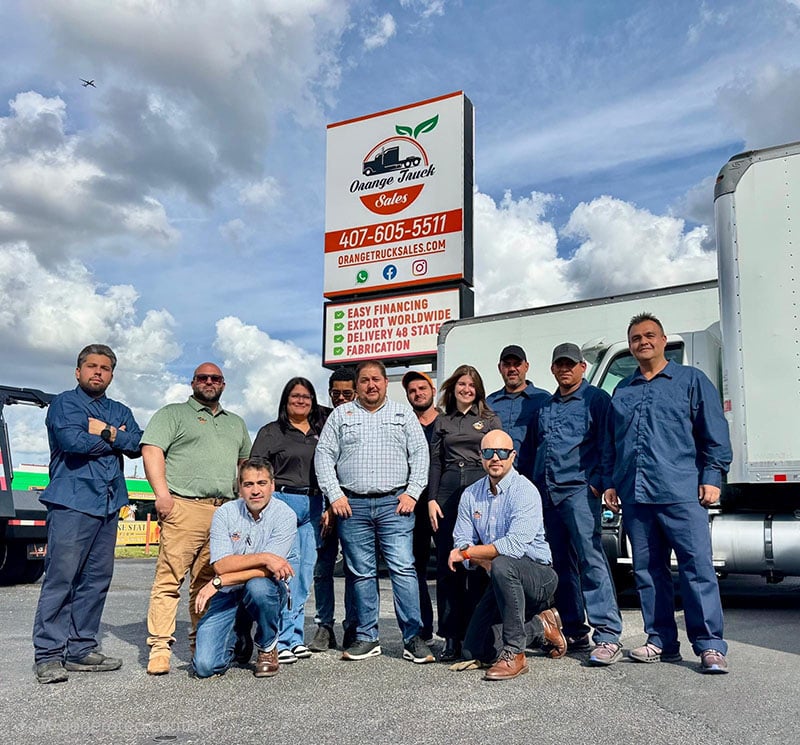 orange truck sales team photo